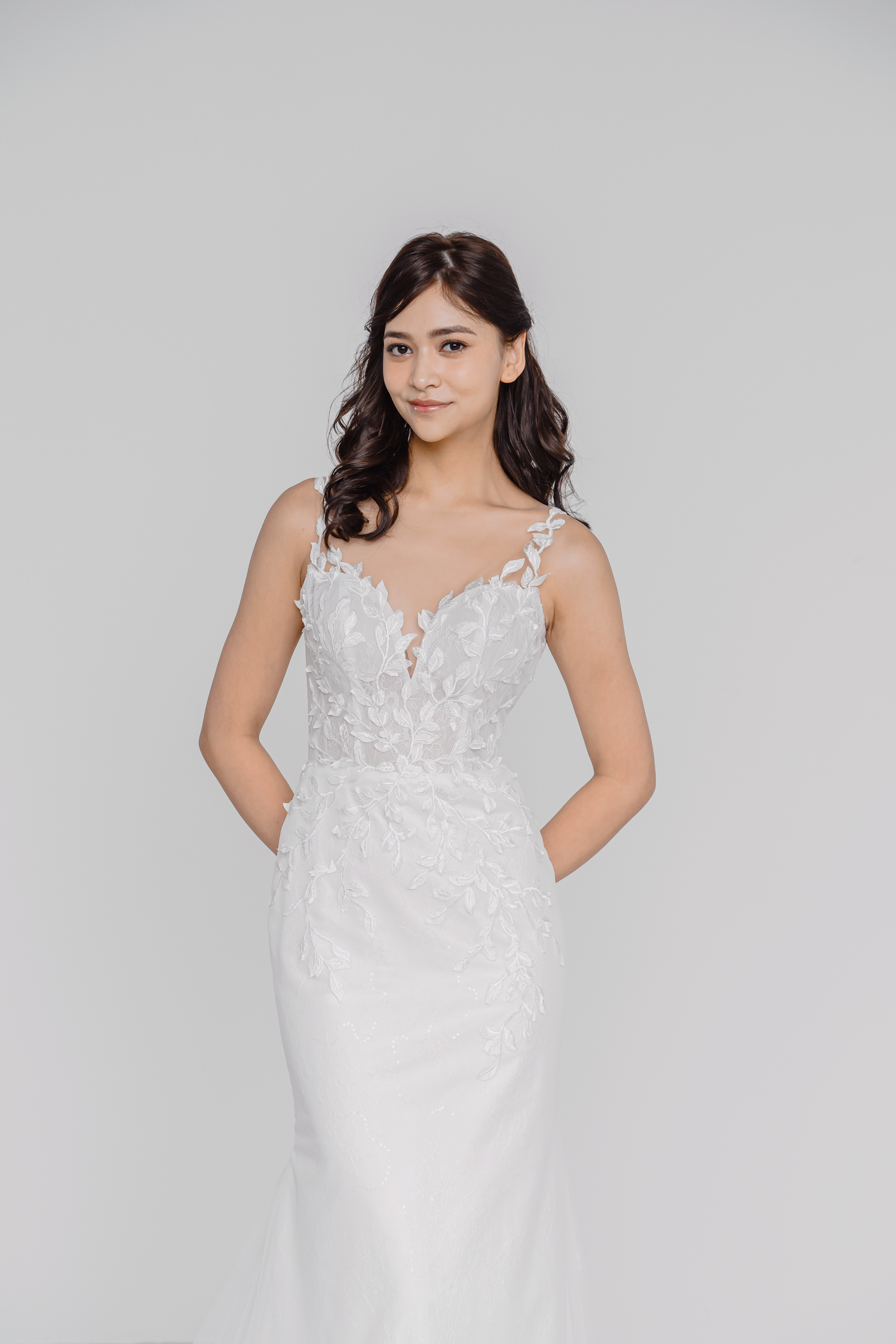 Tricia bridal gown featuring delicate leafy lace appliqués across the bodice