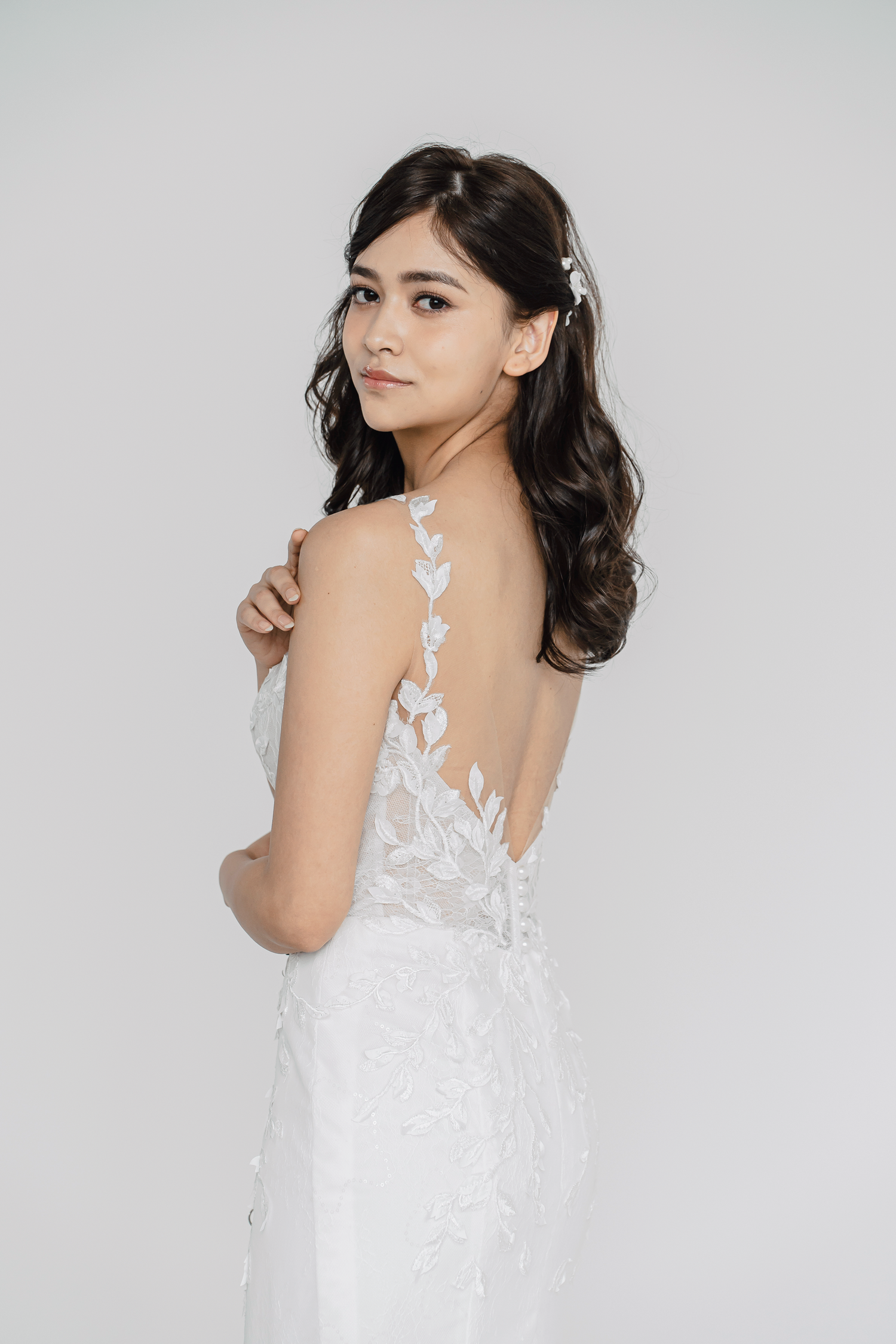 Tricia wedding gown side view with a flattering fitted silhouette
