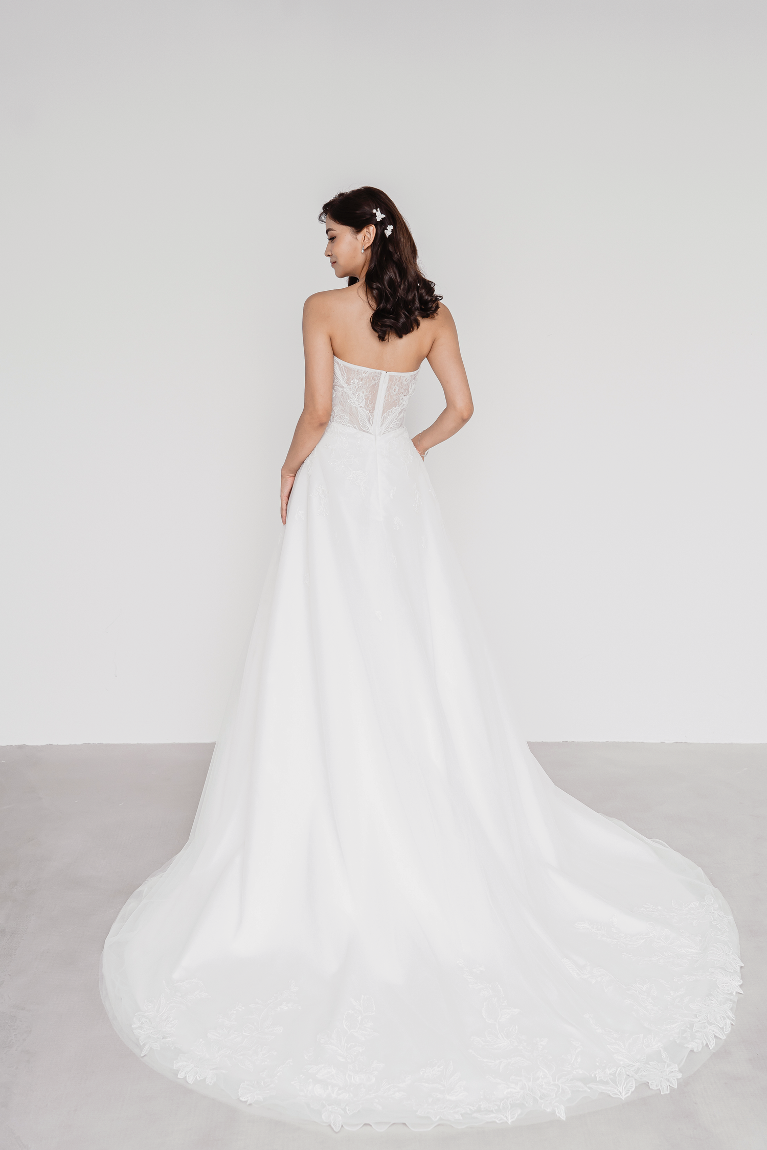 Trudy wedding gown back view with a flowing A-line skirt