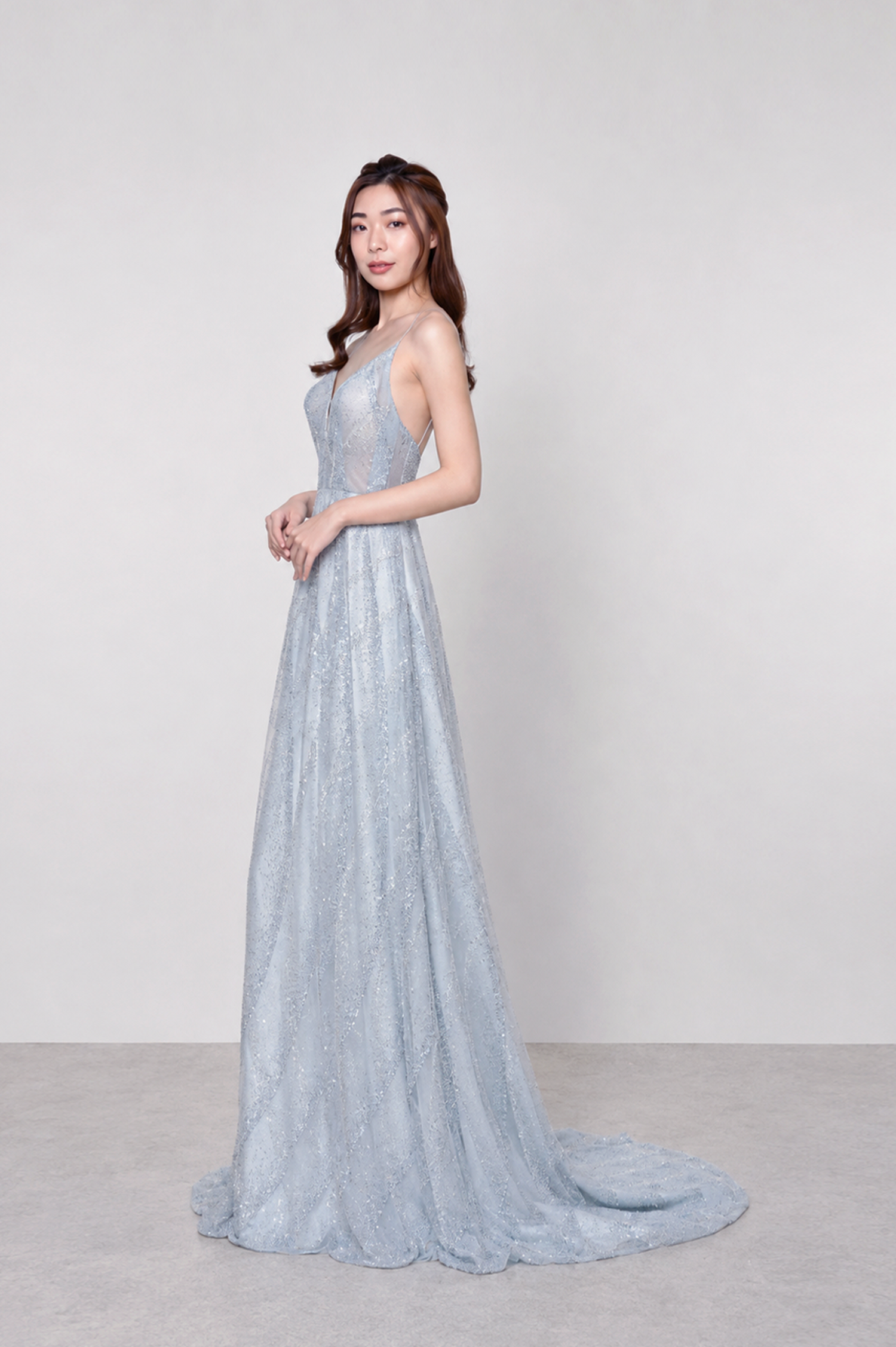Tyra evening gown front view featuring intricate geometric beadwork in mint turquoise hues