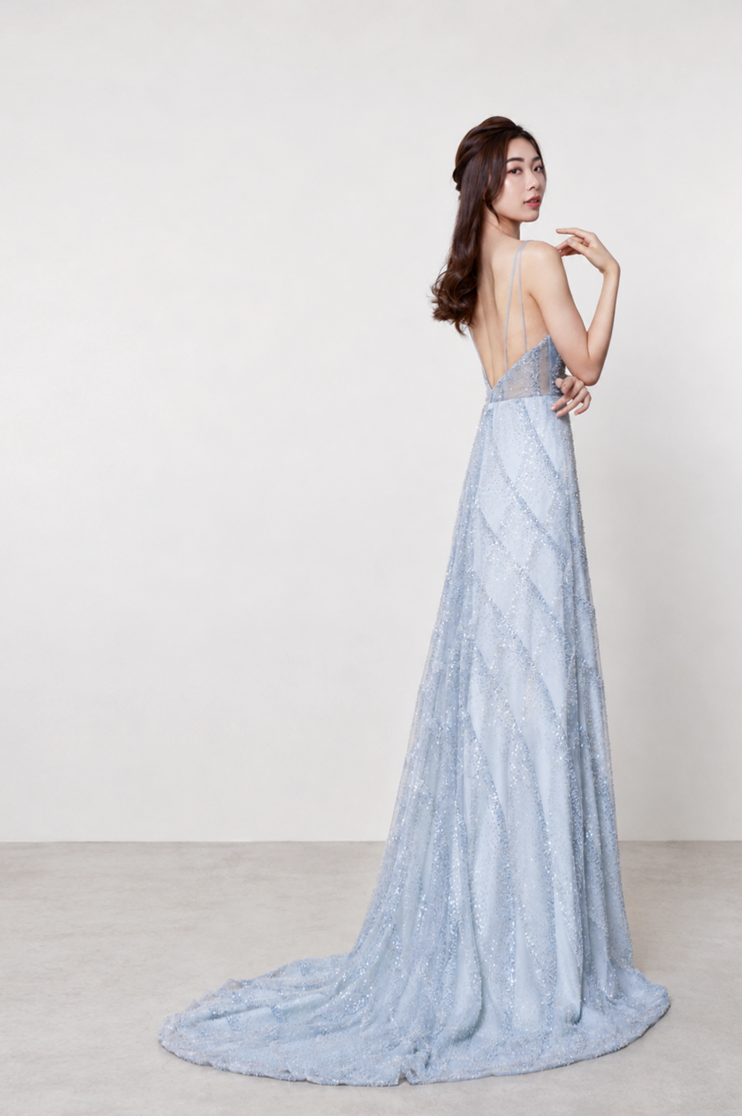 Tyra evening gown side view showcasing the elegant fitted silhouette