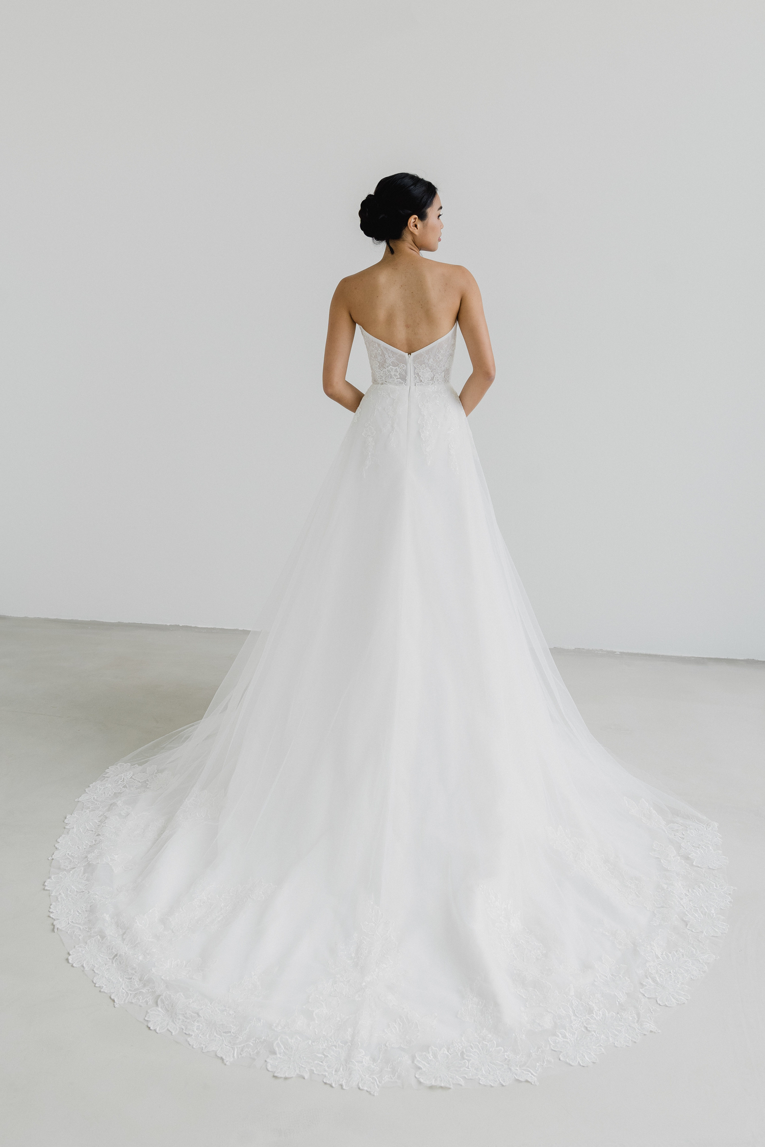 Valene bridal gown featuring a beautifully detailed lace train