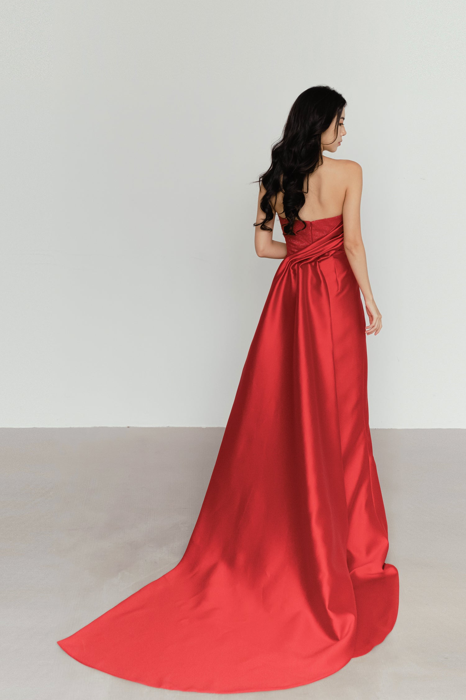 Valentina bridal evening gown train showcasing the luxurious red satin and elegant flow
