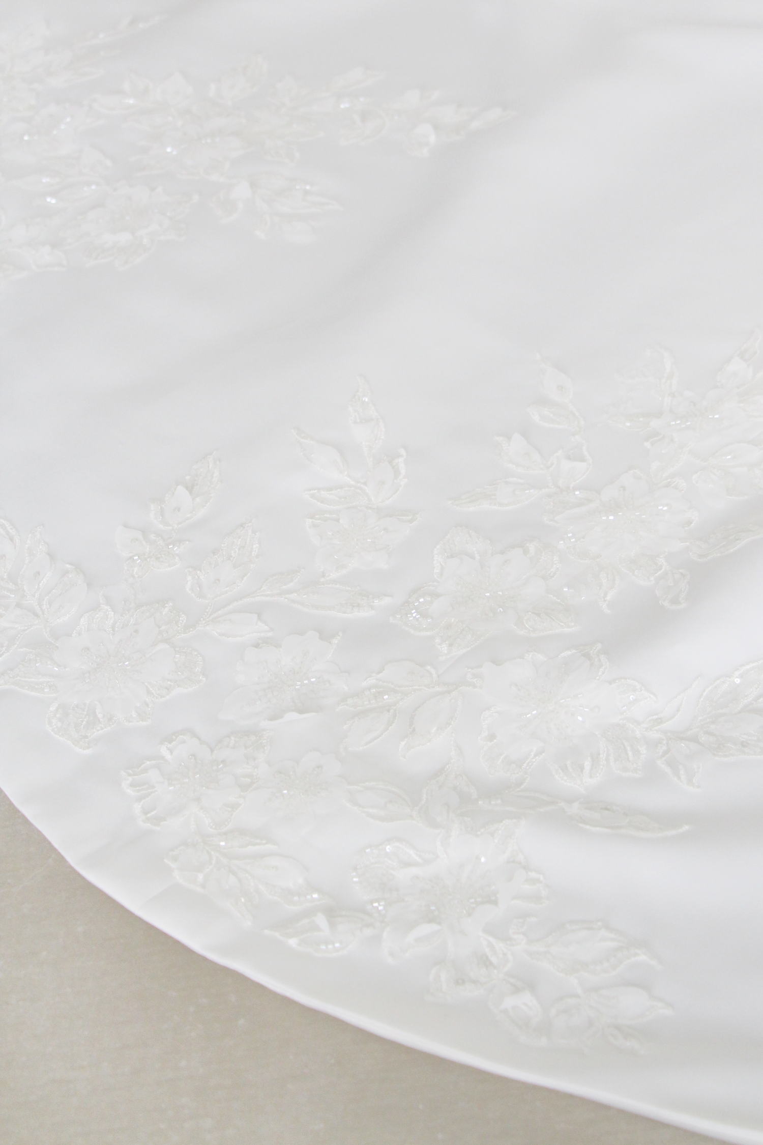 Vania wedding dress featuring an elegant beaded lace train