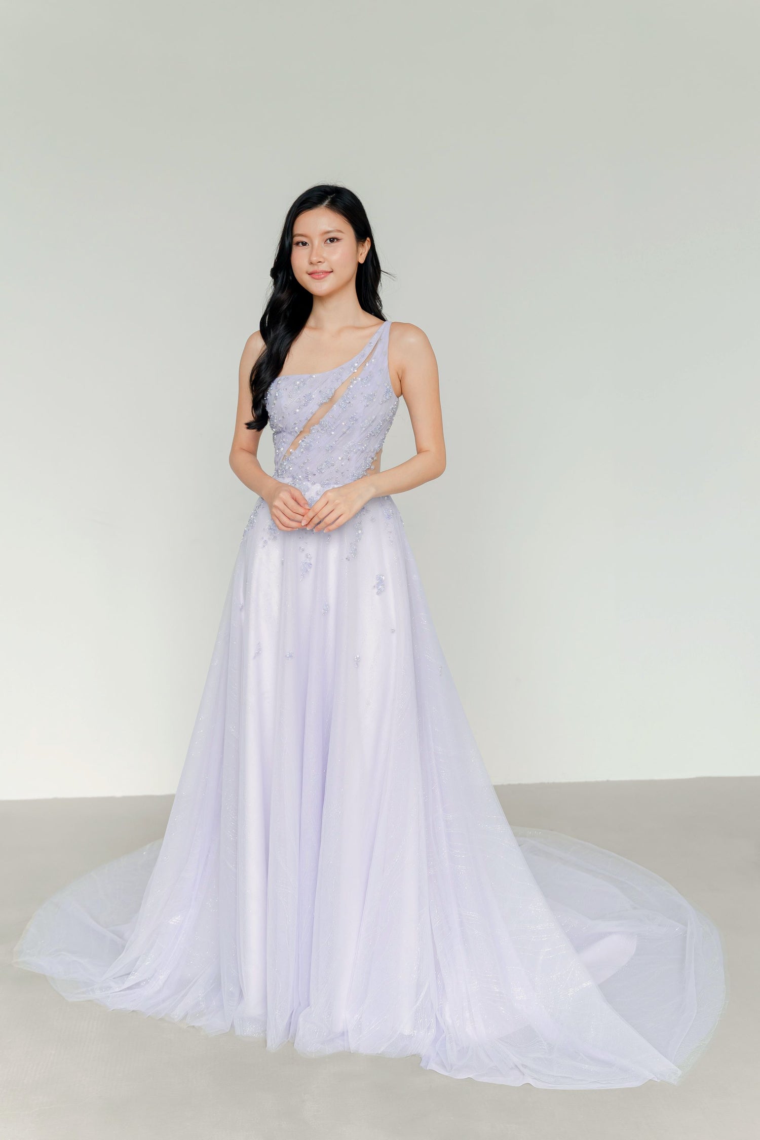 Wisteria bridal evening gown front view in a soft lilac pastel hue with a toga neckline