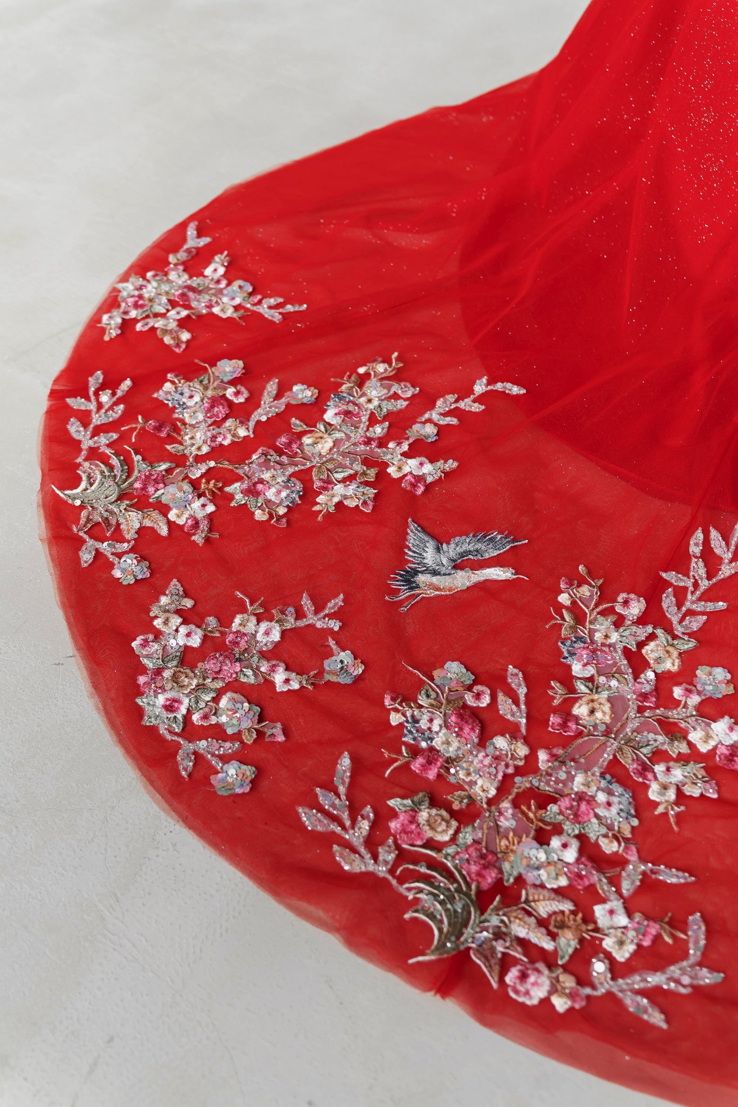 Yasmin wedding cheongsam train showcasing the elegant lace detailing and flowing train