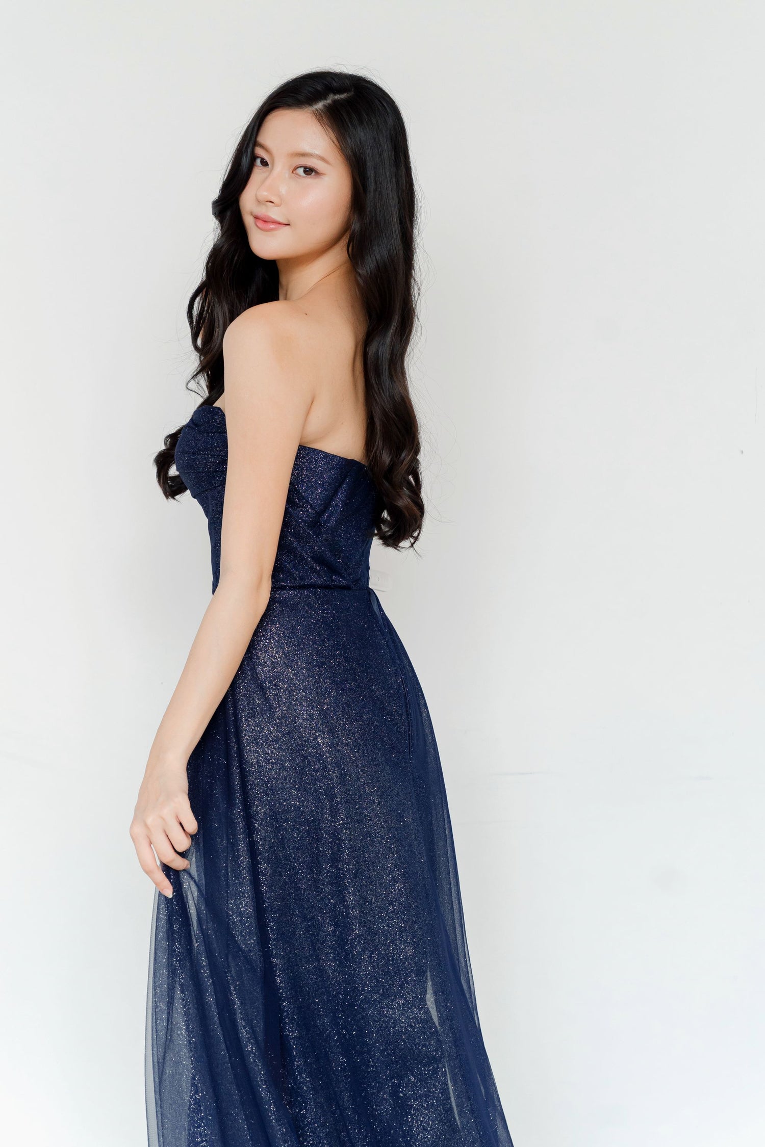 Zanda evening dress back view with an elegant flowing side train